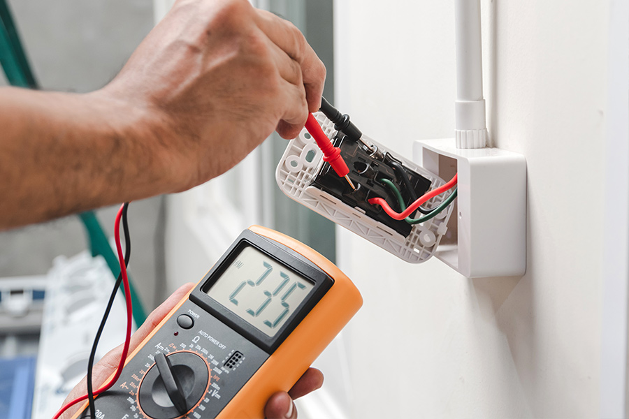 inspector-checking-electrical-outlet-panama-city-fl